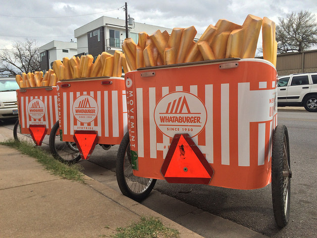 Whataburger wrapped pedicabs with custom built 3D french fries. Waiting to roll out during SXSW.