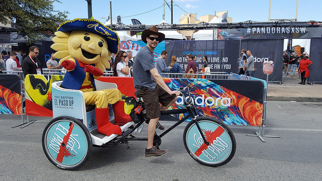 Luke giving Amigo Man a ride during South by Southwest SXSW on an El Paso wrapped pedicab.
